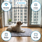 RooPad on an apartment balcony with four feature badges: reusable, washable, tracked shipping, 60-day guarantee
